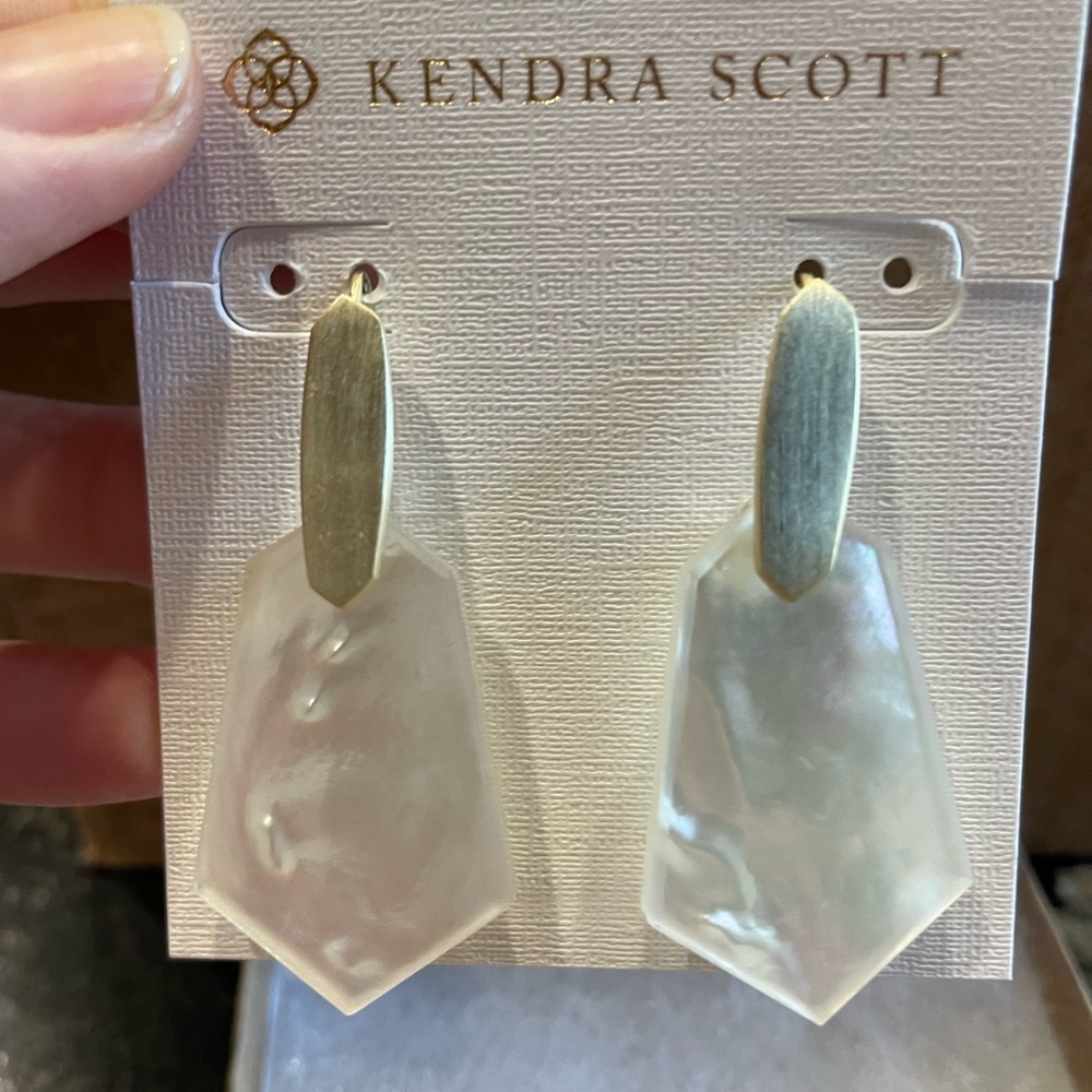 NWOT Kendra Scott Mother of Pearl earrings New still in packaging. Never Worn
